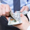 Human hands exchanging money – closeup shot Human hands exchanging money - closeup shot