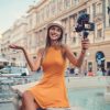 Young woman on a summer vacation vlogging from the city Young woman on a summer vacation vlogging from the city